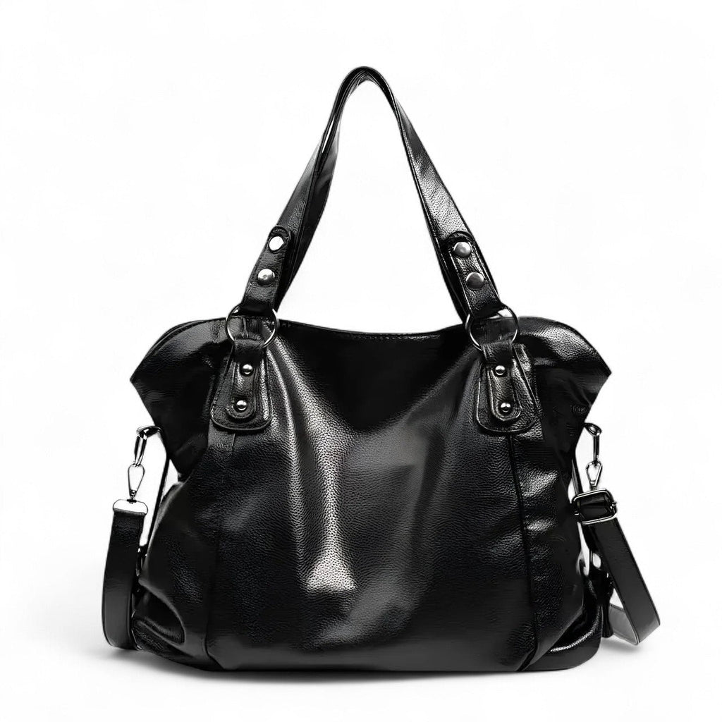 Grand sac hobo en cuir végan grainé noir, de face, anses rivetées et bandoulière détachable