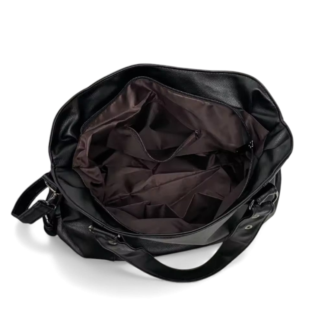 Intérieur doublé de tissu brun, large compartiment ouvert et poche zippée du grand sac noir