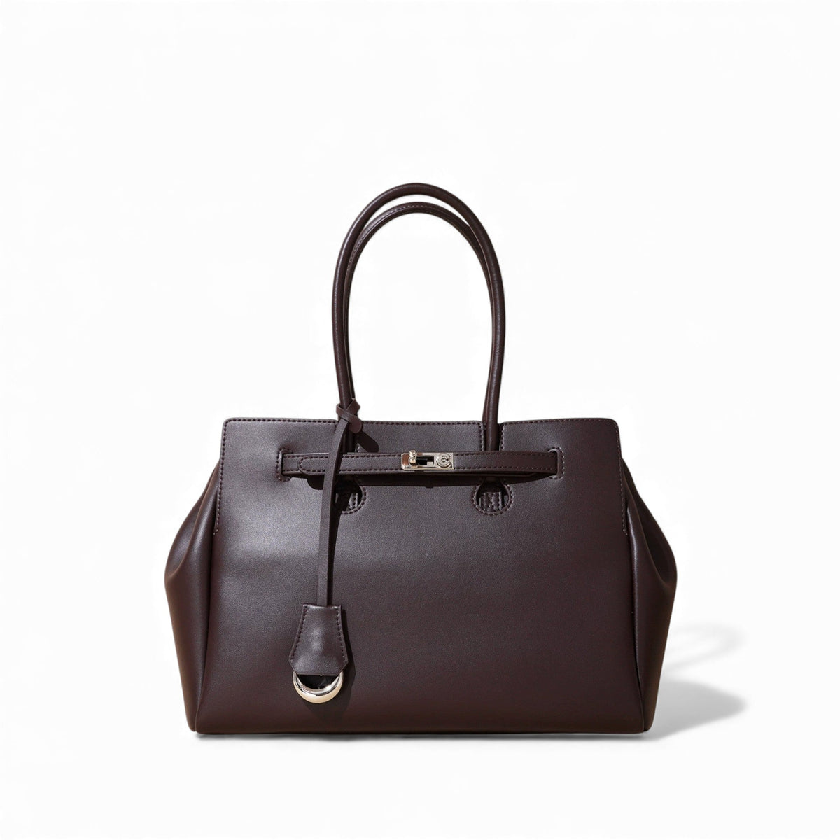 Cartable trapèze en cuir végan brun aubergine, fermoir tourniquet et clochette argentés, de face
