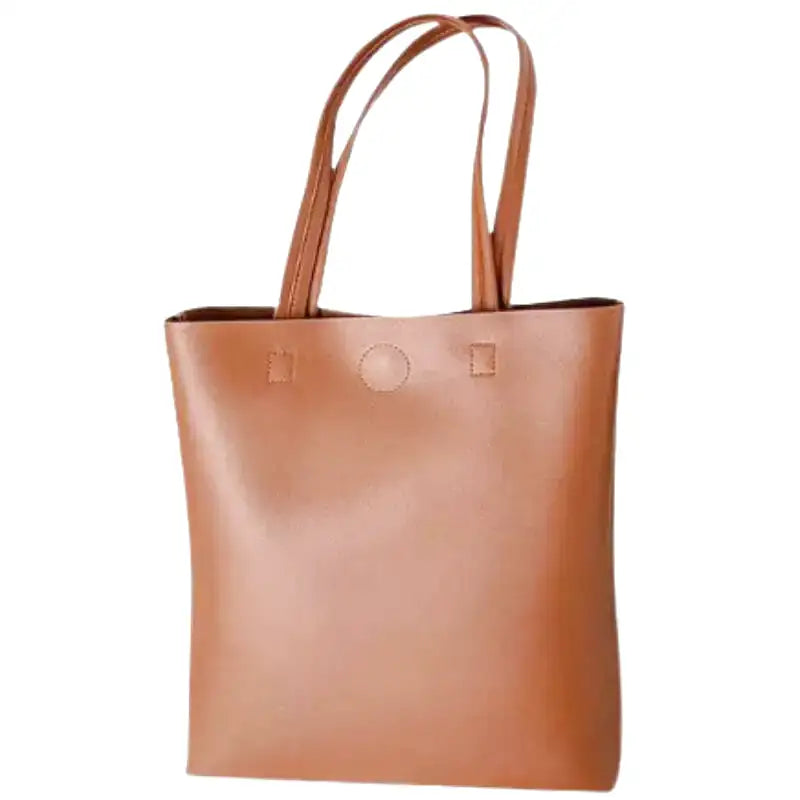 Fourre-tout cognac au grain lisse, anses longues et fermeture par bouton pression, vu de face