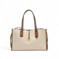 Cabas en toile de coton beige lin, anses et bordures en cuir végan caramel, présenté seul de face