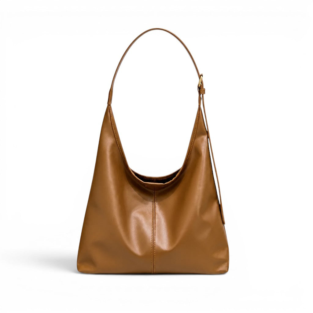 Sac d'épaule cognac lumineux, ligne trapèze, anse réglable et surpiqûre centrale sur la façade