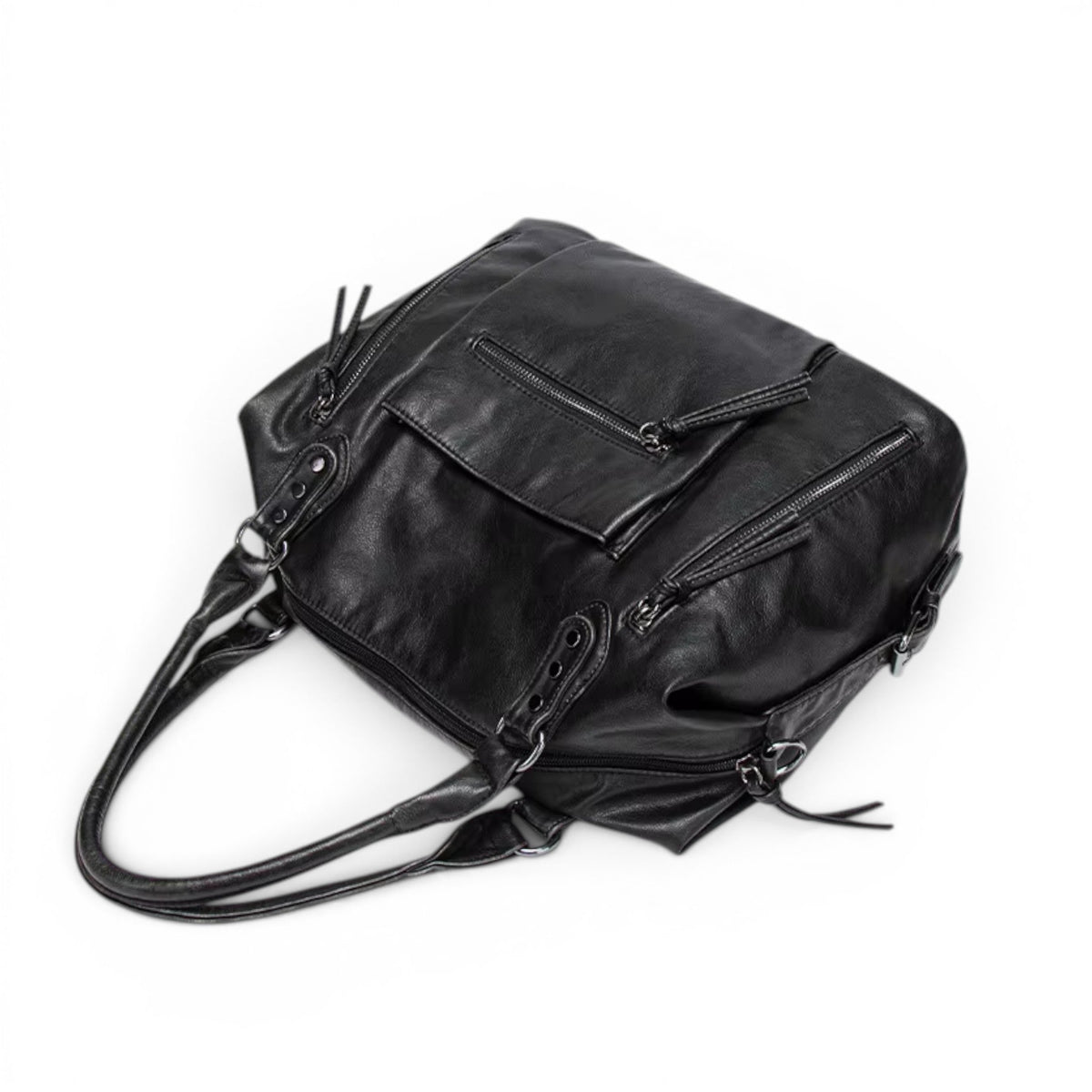Face arrière du sac noir vue en plongée, poche zippée et anses rabattues sur le dessus