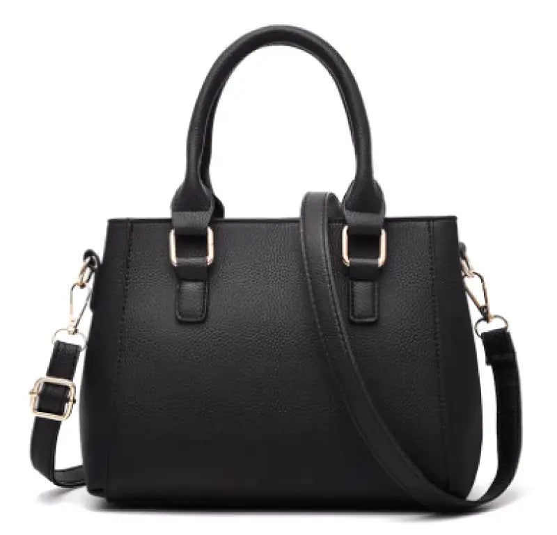 Arrière du sac noir, panneau lisse sans poche, anses rondes et bandoulière unie accrochée