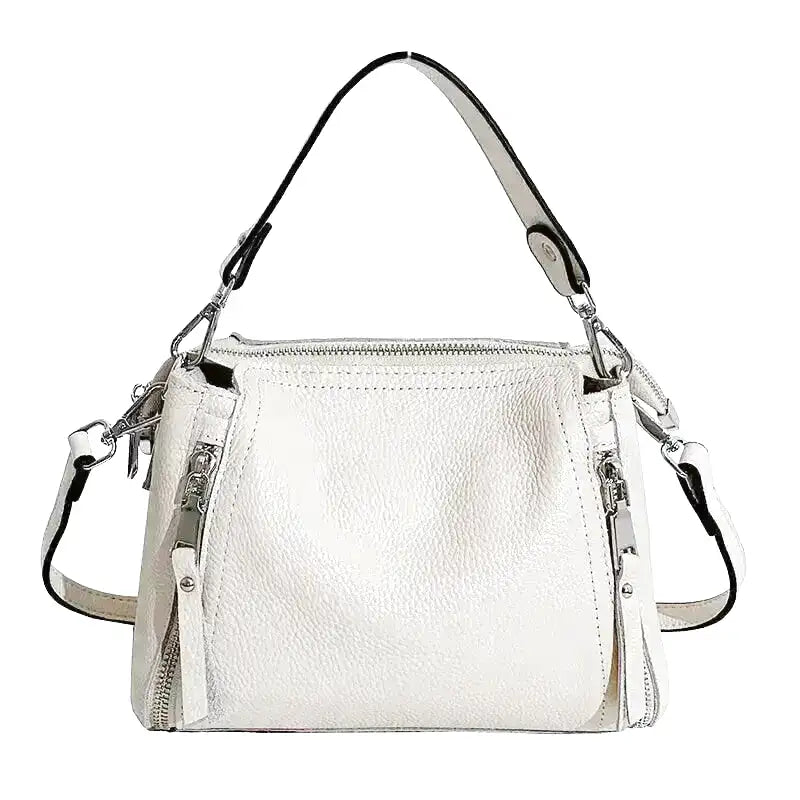 Petite besace blanche à double zip latéral, anse épaulière et bandoulière amovible argentée