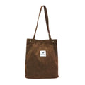 Tote bag en velours côtelé marron, vu de face, longues anses et étiquette brodée