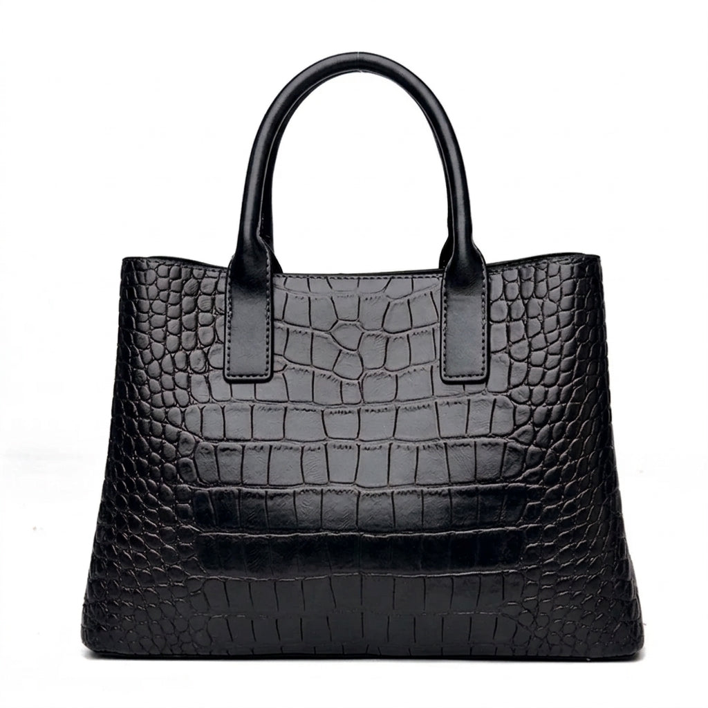 Dos entièrement lisse du sac noir façon croco, anses rondes dressées et base élargie