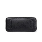 Fond plat du sac noir, patins de protection ovales et coutures de renfort apparentes
