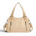 Hobo beige clair à deux poches zippées frontales, anse d'épaule souple, posé de face