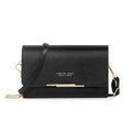 Petit sac bandoulière noir à texture pailletée, rabat retenu par une barrette dorée, sangle fine