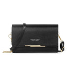 Petit sac bandoulière noir à texture pailletée, rabat retenu par une barrette dorée, sangle fine