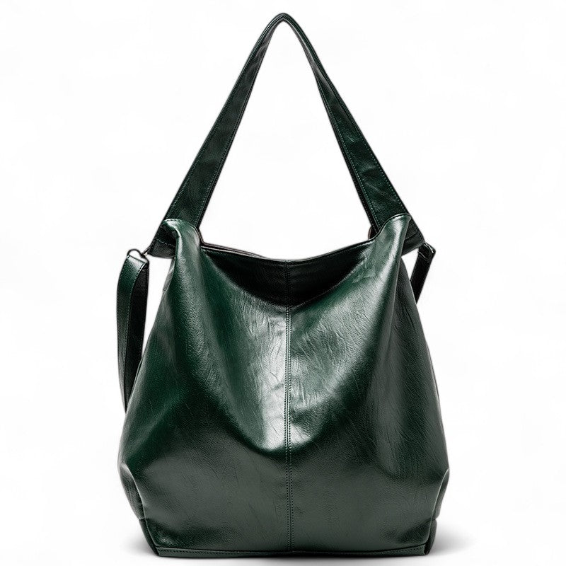 Vert sapin brillant, le grand sac fourre-tout montre son ouverture souple et son fond large