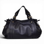 Silhouette froncée du sac noir sur fond sombre, anses doubles à boucles dorées et liens latéraux