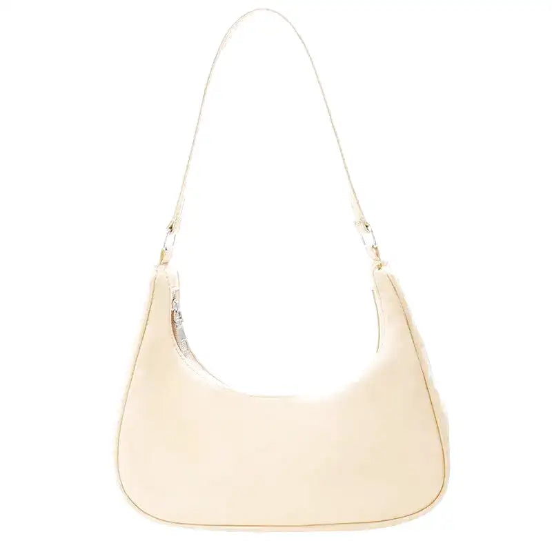 Coloris jaune vanille très pâle pour ce sac hobo arrondi, anse courte et zip discret