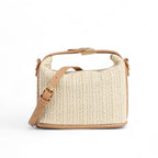Petit sac seau en paille tressée écrue, finitions et bandoulière réglable en similicuir camel